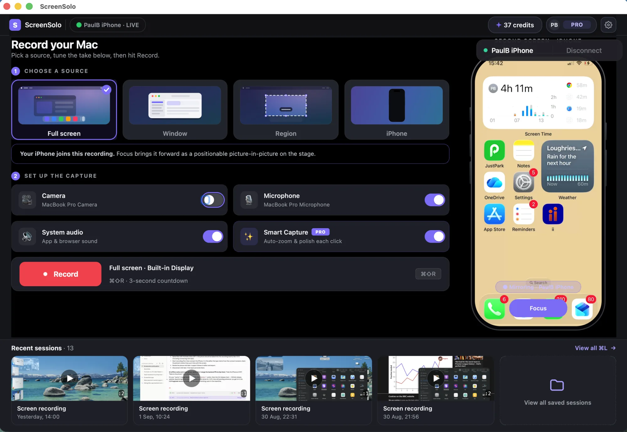 The ScreenSolo Console with an iPhone mirrored live in the device bay — Full screen selected as the source and the phone joining the recording, with microphone, system audio and Smart Capture switched on and a shelf of recent recordings below.